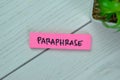 Concept of Paraphrase write on sticky notes isolated on Wooden Table Royalty Free Stock Photo