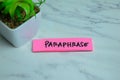 Concept of Paraphrase write on sticky notes isolated on Wooden Table Royalty Free Stock Photo