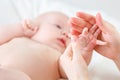 Concept of parental love. baby hand holding finger of mother Royalty Free Stock Photo