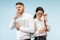 Concept of partnership in business. Young man and woman standing at studio Royalty Free Stock Photo