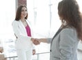 Welcome handshake women business partners