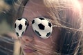 The concept is passion for football. Beautiful girl- football fan, close-up, with glasses football ball Royalty Free Stock Photo