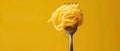 Twirled Pasta Perfection on a Fork Against Yellow. Concept Pasta, Food Photography, Twirling Action, Fork, Yellow Background Royalty Free Stock Photo