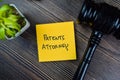 Concept of Patents Attorney write on sticky notes isolated on Wooden Table