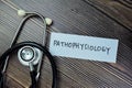 Concept of Pathophysiology write on sticky notes with sthethoscope isolated on Wooden Table Royalty Free Stock Photo