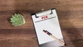 Concept of PCE - Personal Consumption Expenditures write on paperwork isolated on Wooden Table Royalty Free Stock Photo