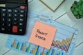 Concept of Penny Stock write on sticky notes isolated on Wooden Table