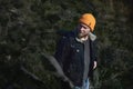 Portrait of a young lamber hiking man in forrest in automn and looking away. Concept of people traveling in nature Royalty Free Stock Photo