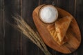 Concept of perfect breakfast in the morning. Coffee white cup and croissant for breakfast on wooden background on the table Royalty Free Stock Photo