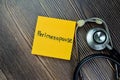 Concept of Perimenopause write on sticky notes with stethoscope isolated on Wooden Table