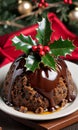 Photo Of Christmas Pudding With A Sprig Of Holly. Generative AI