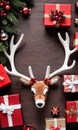 Photo Of Christmas Reindeer Antlers Beside A Pile Of Gifts. Generative AI