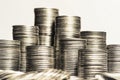 Concept photo.Coins close-up on the table. A lot of coins, selective focus.Front view of stacks of Euro coins.Simple and