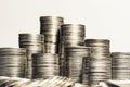 Concept photo.Coins close-up on the table. A lot of coins, selective focus.Front view of stacks of Euro coins.Simple and