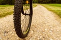 Detail of bicycle wheel in forest dirty track