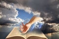 open bible spiritual light divine holy book scripture clouds sun rays beams heaven prayer pray Royalty Free Stock Photo