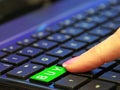 Finger pressing green buy buying button on keyboard computer buying internet online web trading trade Royalty Free Stock Photo