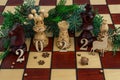 concept photography, new year composition on a chessboard with a queen and other pieces, 2022, Flat lay, copy space Royalty Free Stock Photo