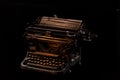 Concept shot of antique manual typewriter with paper on black background, selective focus Royalty Free Stock Photo