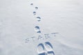 Concept inscription start and footprints in snow. New Year. Beginning. first step
