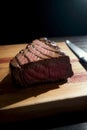 A Piece Of Steak Sitting On Top Of A Wooden Cutting Board. Generative AI