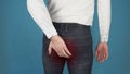 Man has pain due to Hemorrhoids. Concept of piles or hemorrhoidal disease in in the anal canal due to long-term work at