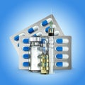 Concept of Pills, vial, ampoule and syringe on blue