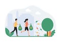 Concept plogging. Teenagers volunteers run in the park, collect garbage, plastic, bottles in trash bags. Eco protection, picking u