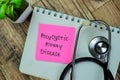 Concept of Polycystic Kidney Disease write on sticky notes with stethoscope isolated on Wooden Table