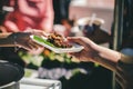 The concept of poverty leads to food shortages: homeless people wait to receive food donations from donors Royalty Free Stock Photo