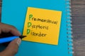 Concept of PPD - Premenstrual Dysphoric Disorder write on sticky notes isolated on Wooden Table Royalty Free Stock Photo