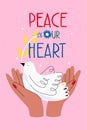 Concept pray for peace in Ukraine. Banner with dove in the hands. Hand lettering peace in our heart. Symbol of no war. Royalty Free Stock Photo