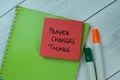 Concept of Prayer Changes Things write on sticky notes isolated on Wooden Table Royalty Free Stock Photo