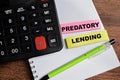 Concept of Predatory Lending write on sticky notes isolated on Wooden Table Royalty Free Stock Photo