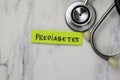 Concept of Prediabetes write on sticky notes with stethoscope isolated on Wooden Table