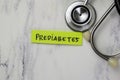 Concept of Prediabetes write on sticky notes with stethoscope isolated on Wooden Table Royalty Free Stock Photo