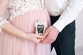 The concept pregnancy, parenthood. Happy couple with pregnancy news. Pregnant couple holding in the hands ultrasound scan of their Royalty Free Stock Photo