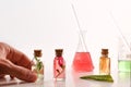 Hands preparing bottles with essence of plants in laboratory Royalty Free Stock Photo