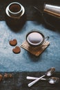 Concept - preparing of coffee. Coffee cup, mocha, coffee maker, roasted beans, spoons, turkisch cezve, biscuits and cardamom. Coff Royalty Free Stock Photo