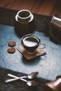 Concept - preparing of coffee. Coffee cup, mocha, coffee maker, roasted beans, spoons, turkisch cezve, biscuits and cardamom. Coff Royalty Free Stock Photo