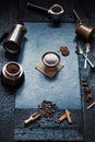 Concept - preparing of coffee. Coffee cup, mocha, coffee maker, roasted beans, spoons, turkisch cezve, biscuits and cardamom. Coff Royalty Free Stock Photo