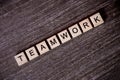 Concept presented by crossword with words teamwork with wooden c Royalty Free Stock Photo