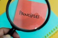 Concept of Principles write on sticky notes isolated on Wooden Table Royalty Free Stock Photo