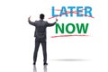 Concept of procrastination with now or later Royalty Free Stock Photo