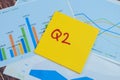 Concept of Q2 - 2nd Quarter Period write on sticky notes isolated on Wooden Table Royalty Free Stock Photo