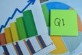 Concept of Q1 - 1st Quarter Period write on sticky notes isolated on Wooden Table. Stock market concept Royalty Free Stock Photo