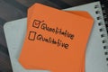 Concept of Quantitative or Qualitative write on a sticky notes isolated on Wooden Table