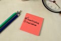 Concept of Quantitative or Qualitative write on sticky notes isolated on Wooden Table