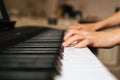 CHILD LEARNS TO PLAY THE PIANO ONLINE Royalty Free Stock Photo