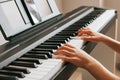 CHILD LEARNS TO PLAY THE PIANO ONLINE Royalty Free Stock Photo